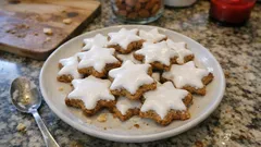 Migdałowe gwiazdki cynamonowe z bezową glazurą – niemieckie ciasteczka na święta